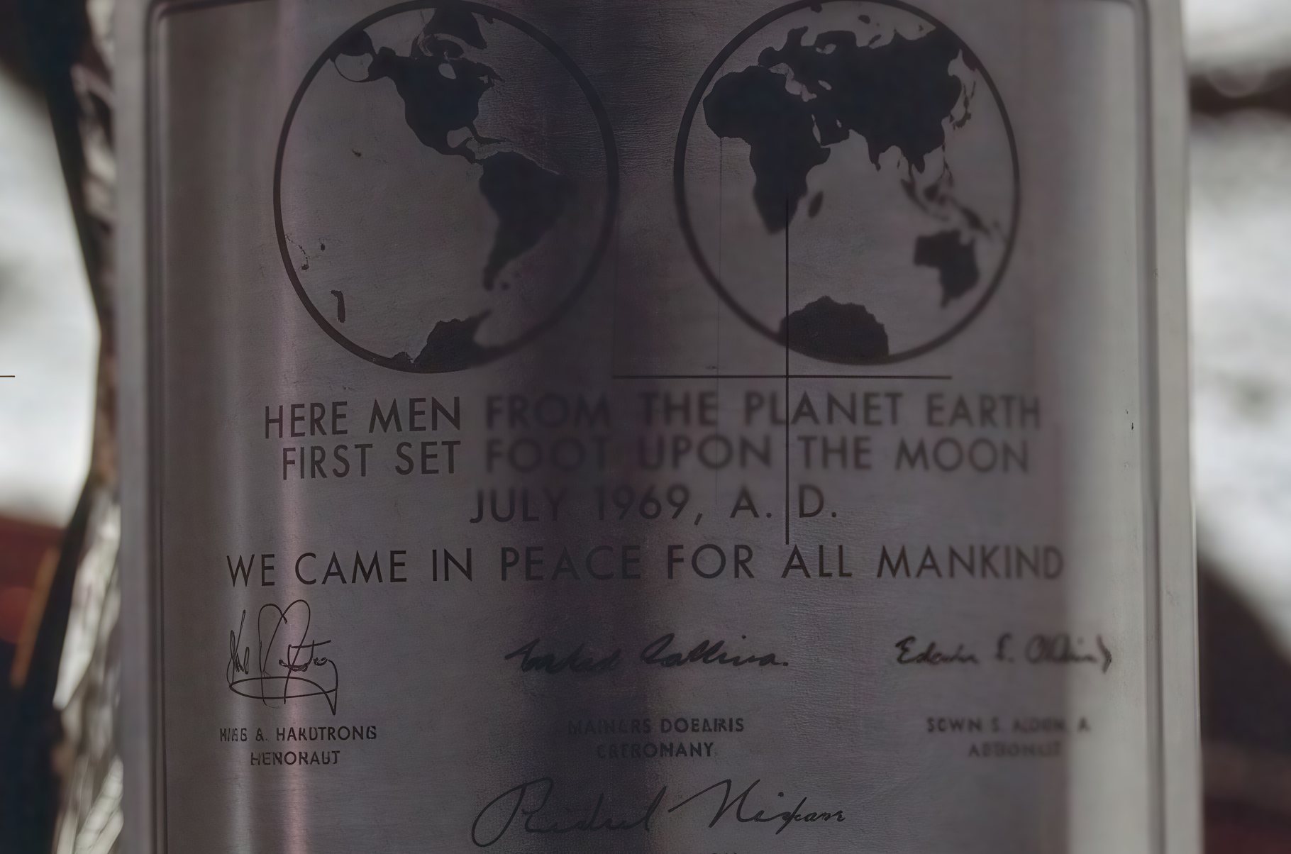 The same plaque after a 4× CraterView.ai enhancement: the engraved lines and the signatures sharper