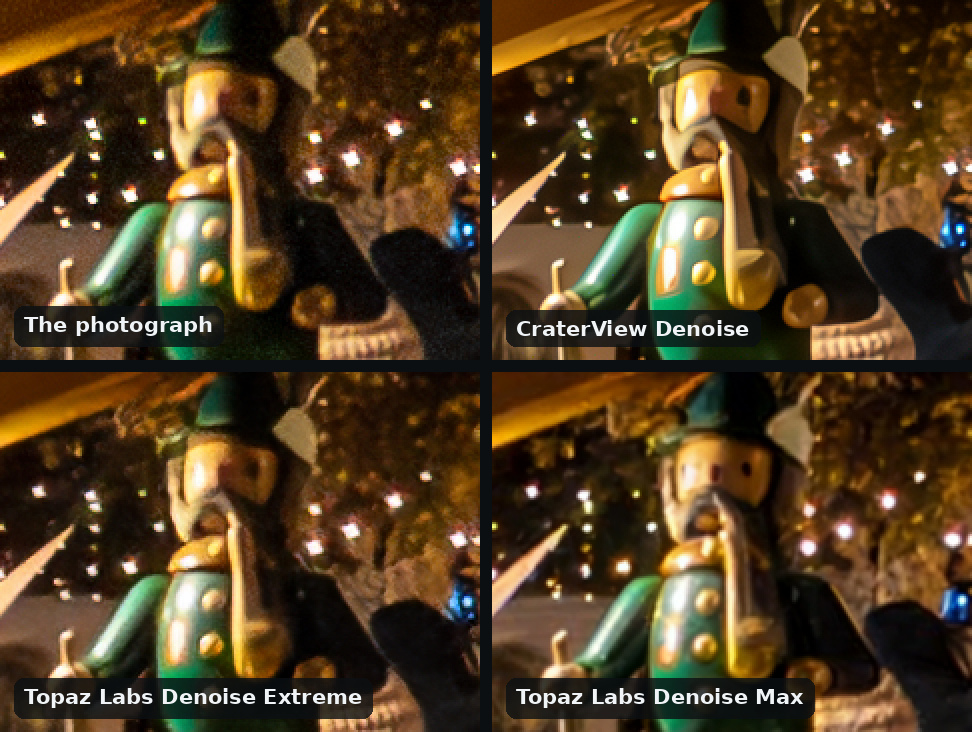Four views of a carved wooden figure in a green coat on a Christmas market's arch at night, ISO 12800, in a grid of four, two across: the photograph, grainy and soft; CraterView Denoise, crisp and clean; Topaz Labs Denoise Extreme, clean but soft; Topaz Labs Denoise Max, crisp, with two eyes and a mouth drawn on the figure's face